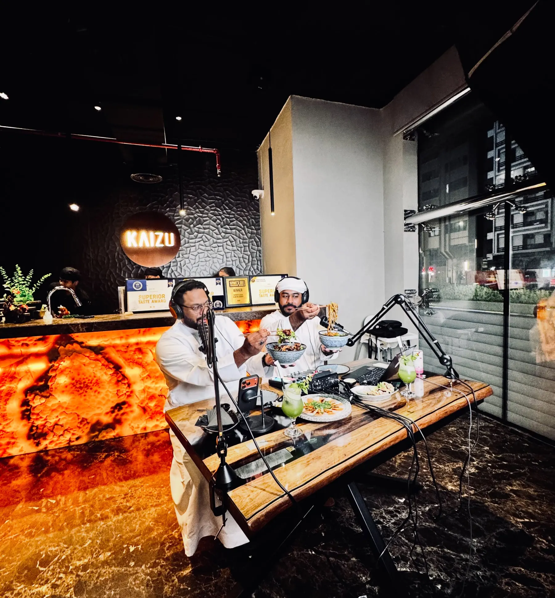 A podcast recorded inside a restaurant, wide of the set