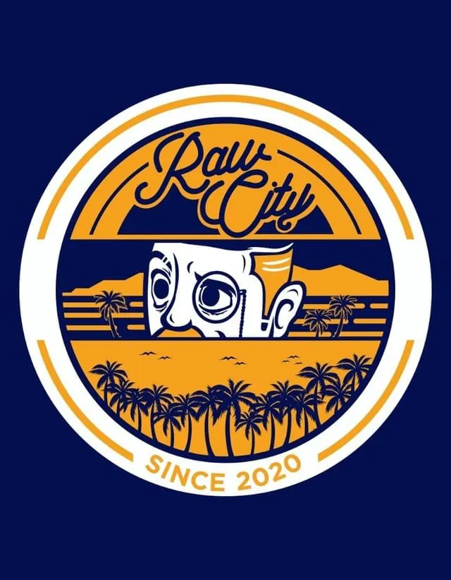 Raw City circular badge in navy and orange: a script logo above a stylised face peering over palm trees, with “Since 2020” along the rim