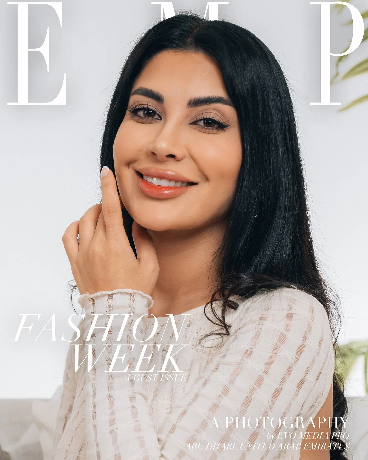 A studio fashion portrait of a woman in cream knitwear, with large editorial lettering across the frame